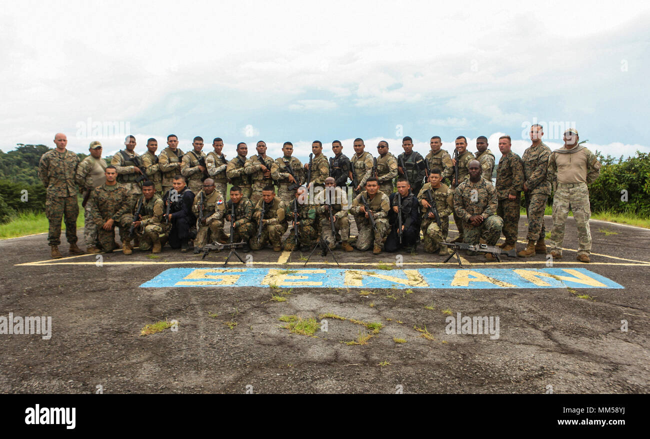 U.S. Marines and sailors with Mobile Training Team One, Command Element, Special Purpose Marine Air-Ground Task Force - Southern Command, pose for a group photo with Panamanian service members from Servicio Nacional Aeronaval and other agencies at Agustin Santos Vinda Base in Quebrada de Piedra, Panama, Aug. 30, 2017. The MTT conducted a three-week course with Panamanian service members consisting of basic infantry tactics, marksmanship, and patrolling. The Marines and sailors of SPMAGTF-SC are deployed to Central America to conduct security cooperation training and engineering projects with t Stock Photo