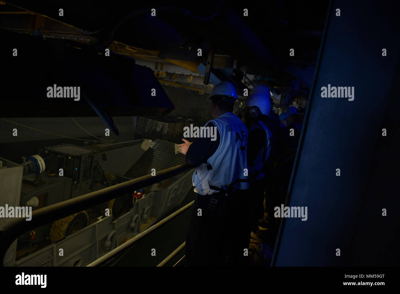 ATLANTIC OCEAN (Sept. 8, 2017) Sailors observe a Landing Craft Utility (LCU), assigned to Assault Craft Unit (ACU) 2, entering the well deck of the amphibious assault ship USS Iwo Jima (LHD 7) in preparation for potential humanitarian relief efforts. The preparations ensure Iwo Jima is ready to respond to any requests to bolster Northern Command’s support of Federal Emergency Management Agency’s assistance to federal, state and local authorities’ ongoing relief efforts in the aftermath of Hurricane Irma. (U.S. Navy photo by Mass Communication Specialist 3rd Class Evan A. Denny/Released) Stock Photo