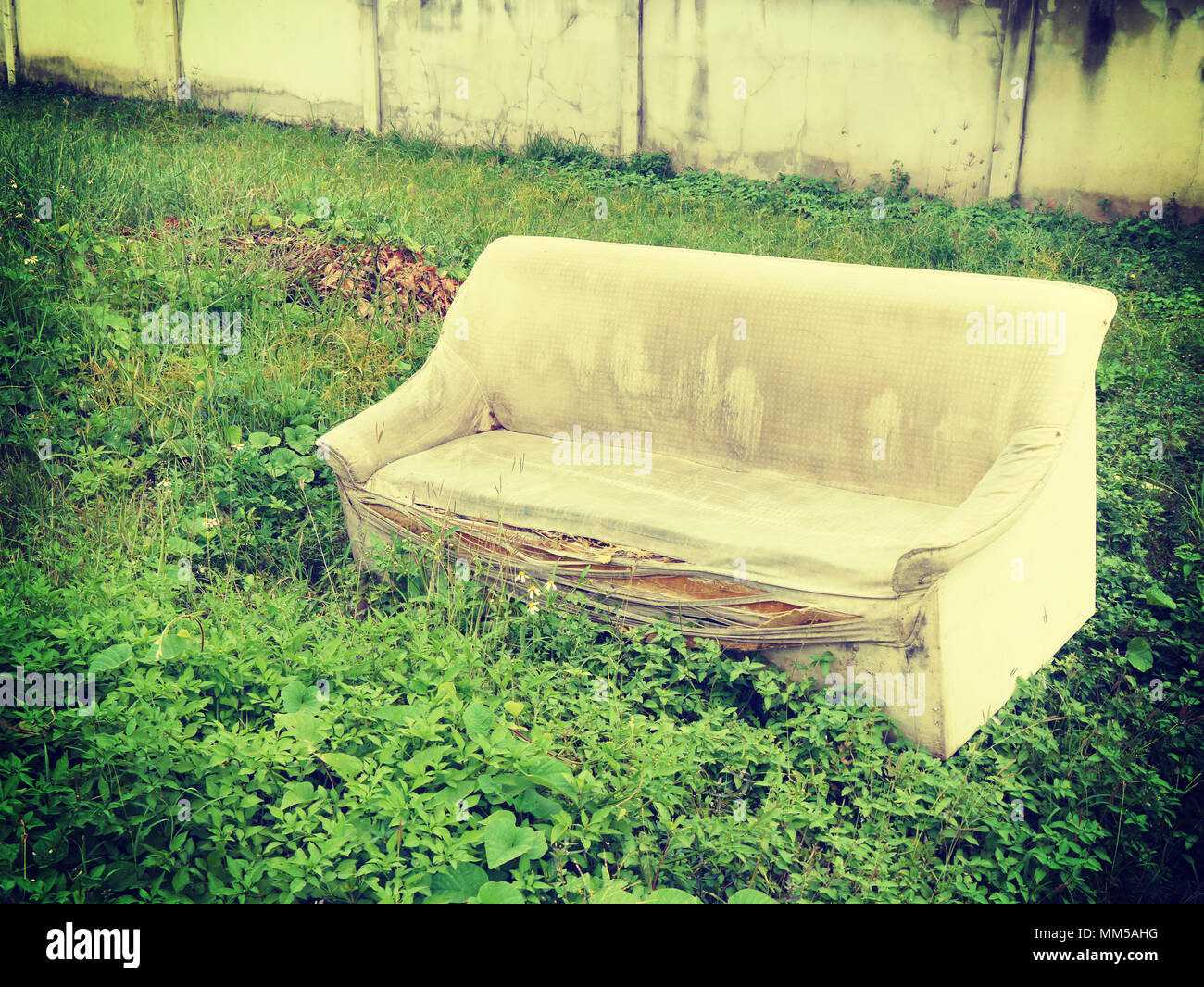 Old broken sofa with retro filter effect Stock Photo - Alamy