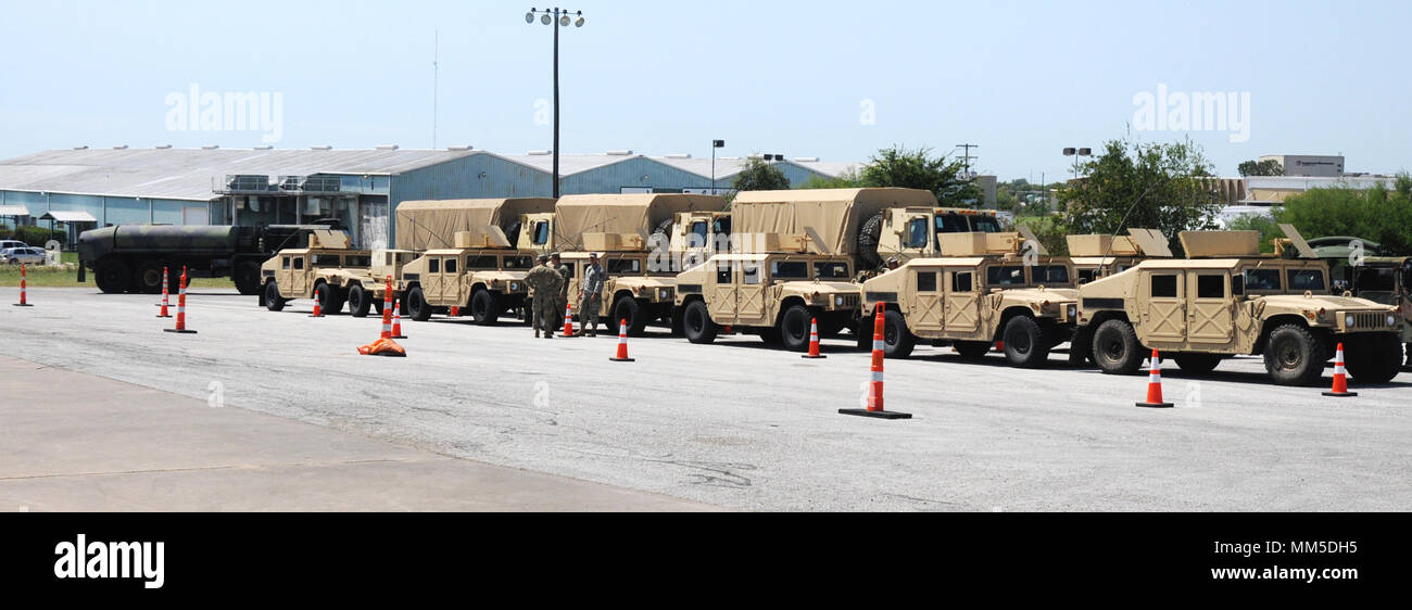 The vehicle staging area at Logistical Staging Area located in Brenham, Texas  fills with a convoy of 156th Brigade Engineer Battalion trucks Sept. 9, 2017. The BEB is returning from relief efforts in Port Arthur. The LSA has elements of the 112th Field Service Quartermaster and 1836th Transportation companies on site. This location has acted as a military rest stop with food, cots, latrines and fuel for units processing in and out of areas where they’ve assisted with Hurricane Harvey relief efforts. Stock Photo