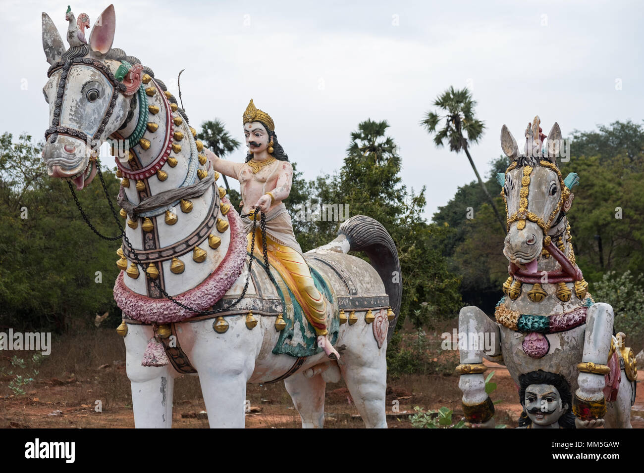 Clay sculptures at a shrine dedicated to the god Ayyanar on the outskirts of a village in Tamil Nadu. Many villages in the state have such shrines. Stock Photo
