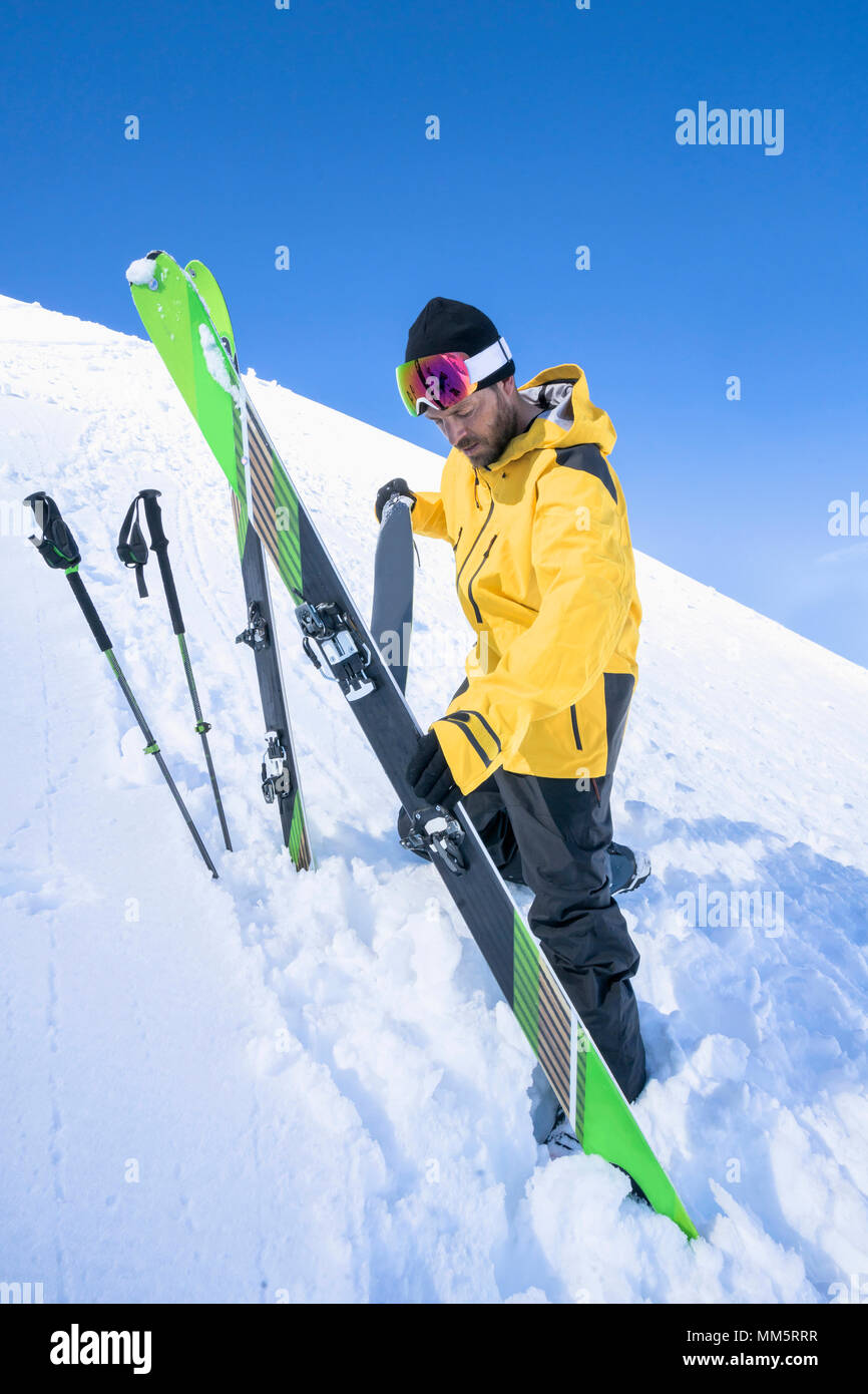 Man taking off ski skin, Bavaria, Germany, Europe Stock Photo