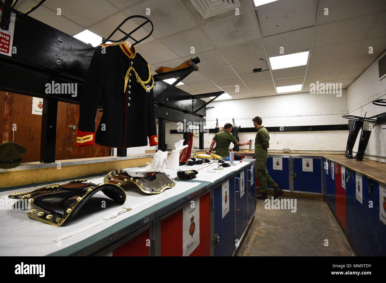 Members of the Household Calvary in the Cleaning Room during a facility to see The Household Cavalry Mounted Regiment preparations for the forthcoming Royal Wedding at Hyde Park Barracks, central London. Stock Photo