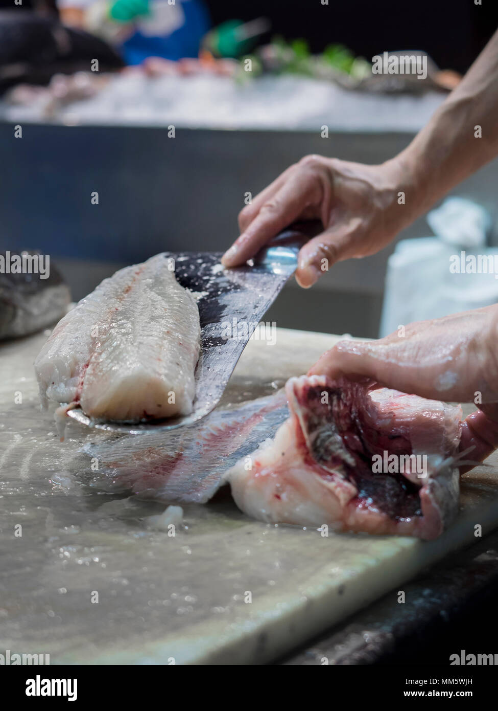 Man preparing fish Stock Photo