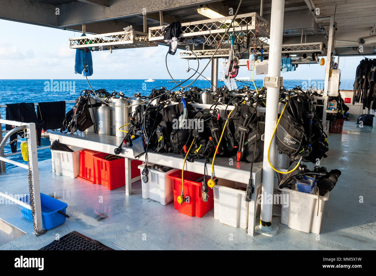 Scuba diving gear on the deck of a live aboard boat ready for the next dive on The Great Barrier