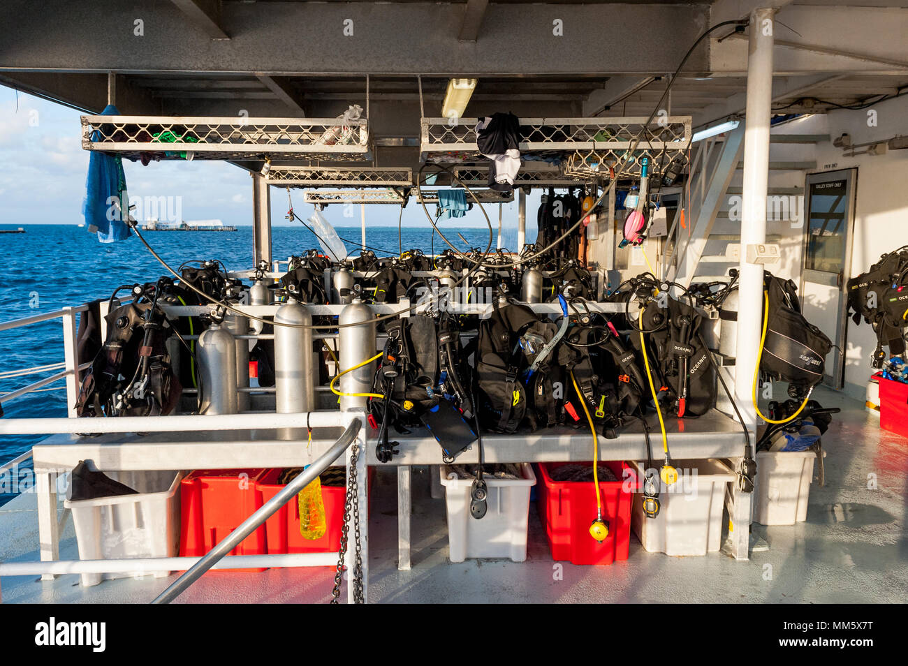 Scuba diving gear on the deck of a live aboard boat ready for the next