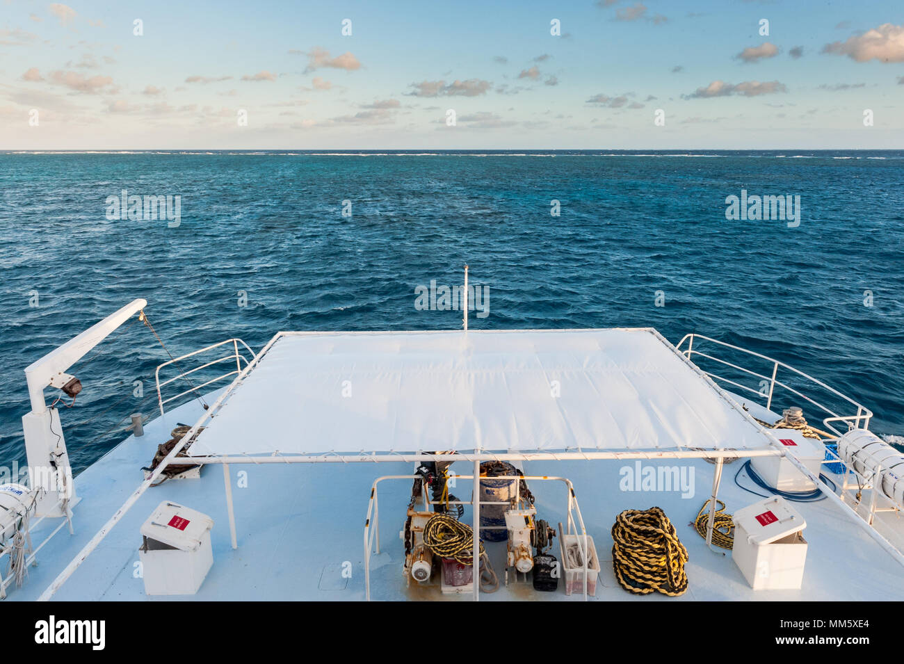 The deck of a live aboard dive boat with coiled ropes just by the Great Barrier Reef Queensland Australia. Stock Photo