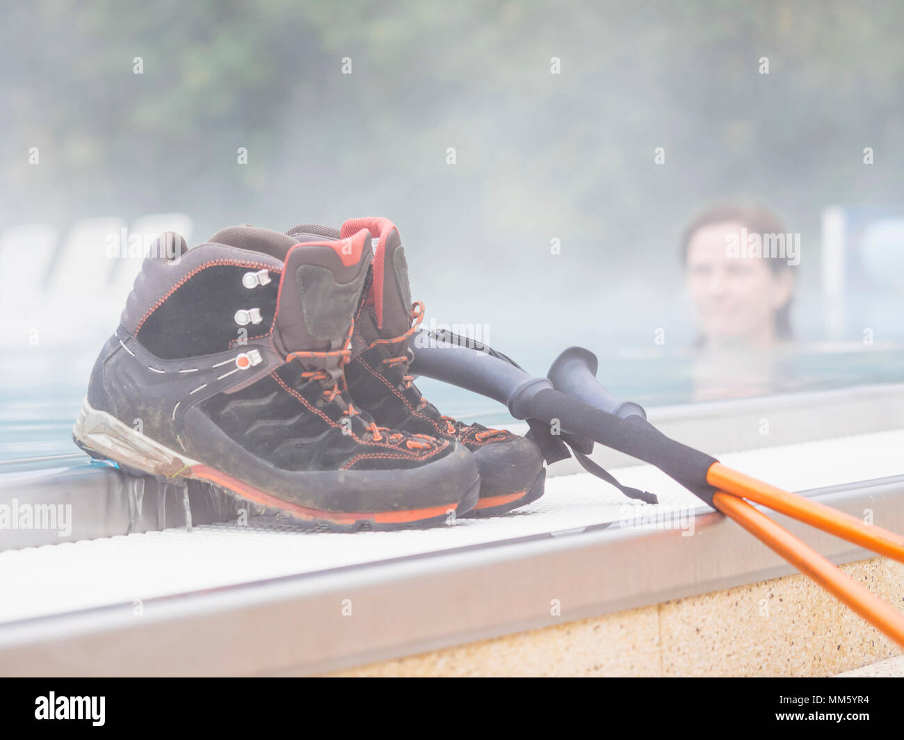 Woman hiker relaxing in swimming pool of ParacelsusTherme, "Bad