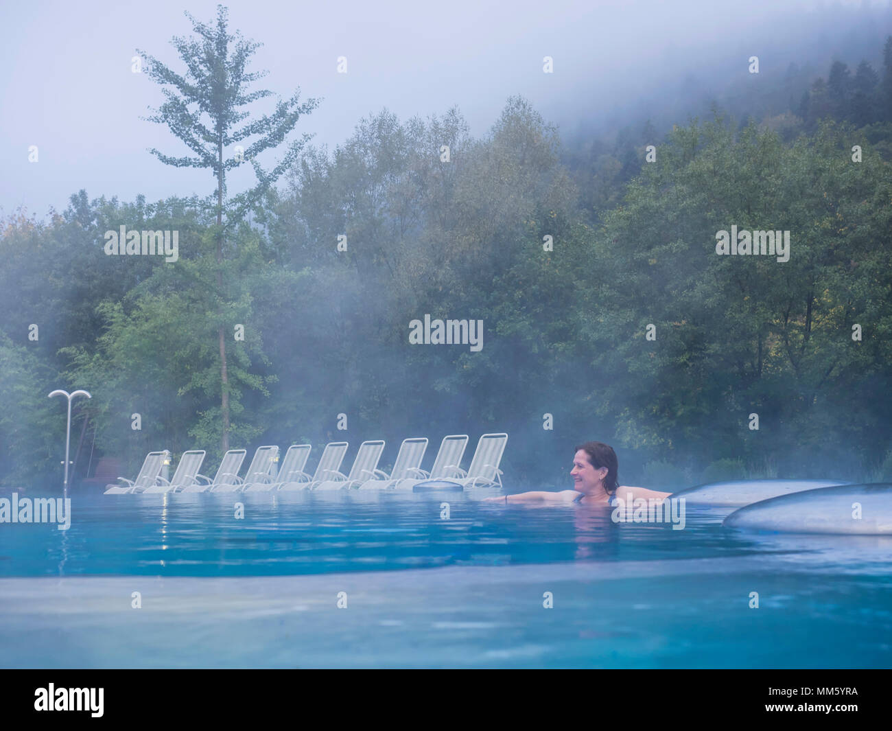 Woman relaxing in swimming pool of ParacelsusTherme, "Bad Liebenzell
