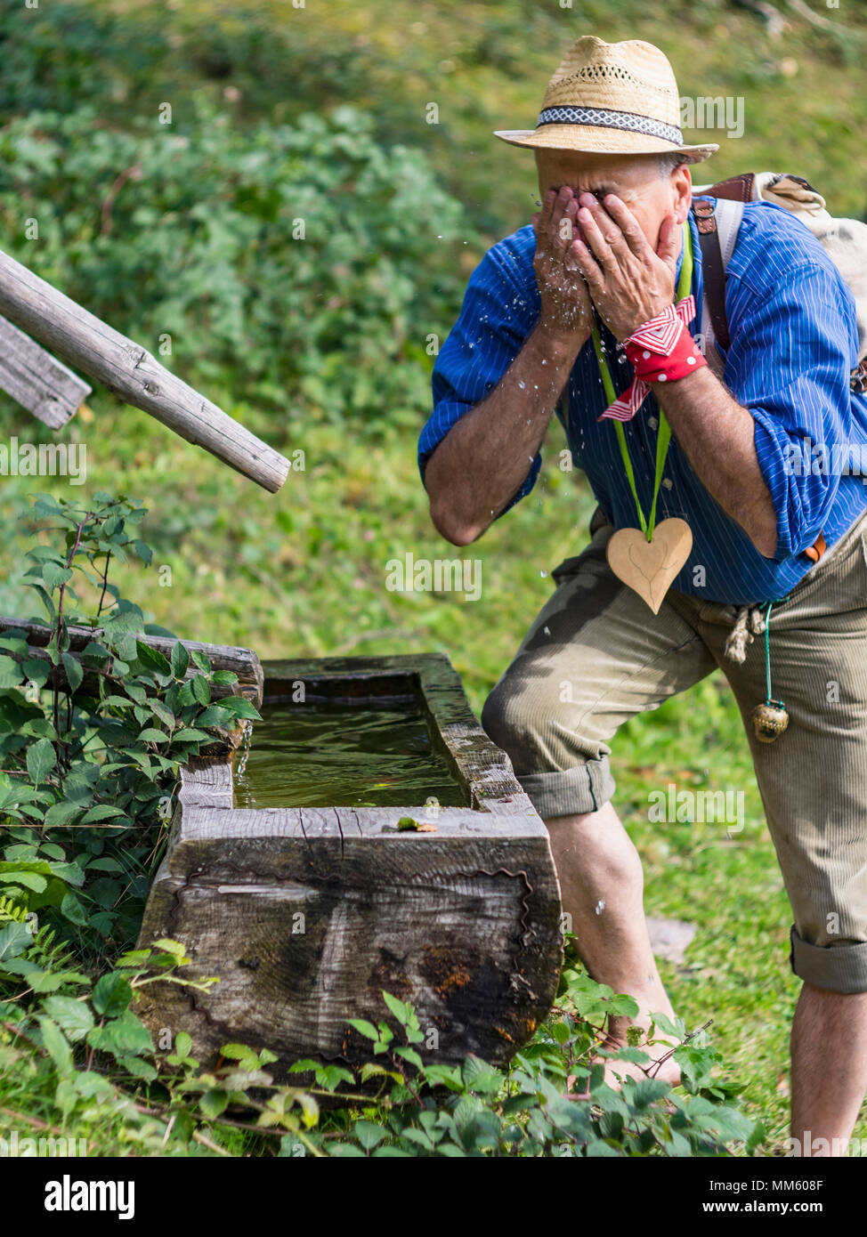 Senior man washing face in Middle Black Forest Baden-Württemberg, Germany Stock Photo