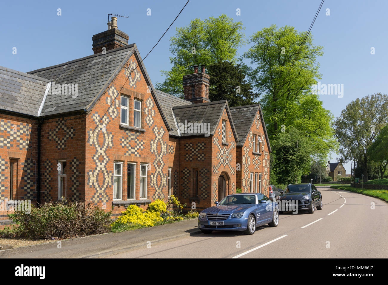 Houses with distinctive brick patterns on the walls; Lamport village