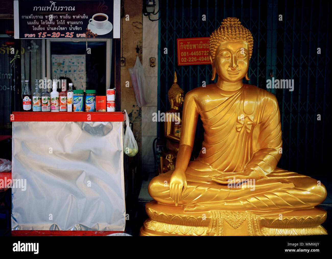 Thai Buddhism - Buddha statue art for sale in Bamrung Muang Road in Bangkok in Thailand in Southeast Asia Far East. Buddhist Serenity Serene Travel Stock Photo