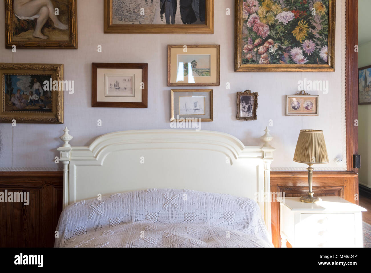 Bedroom Interior with Art Collection  in Giverny , Claude Monet's house and Gardens in Giverny, France Stock Photo