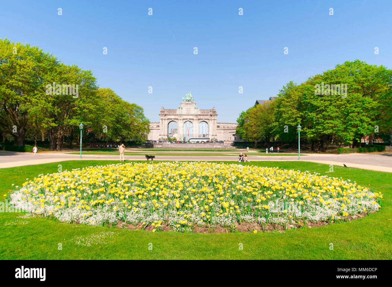 Triumphal arch at the Parc du Cinquantenaire / Jubelpark in Brussels, Belgium. April 2018. With flower bed in front. Stock Photo