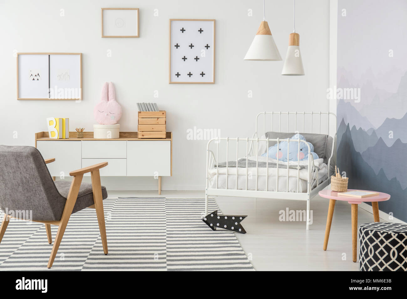 Cute Pillows On A Child S Metal Frame Bed And Simple Wooden
