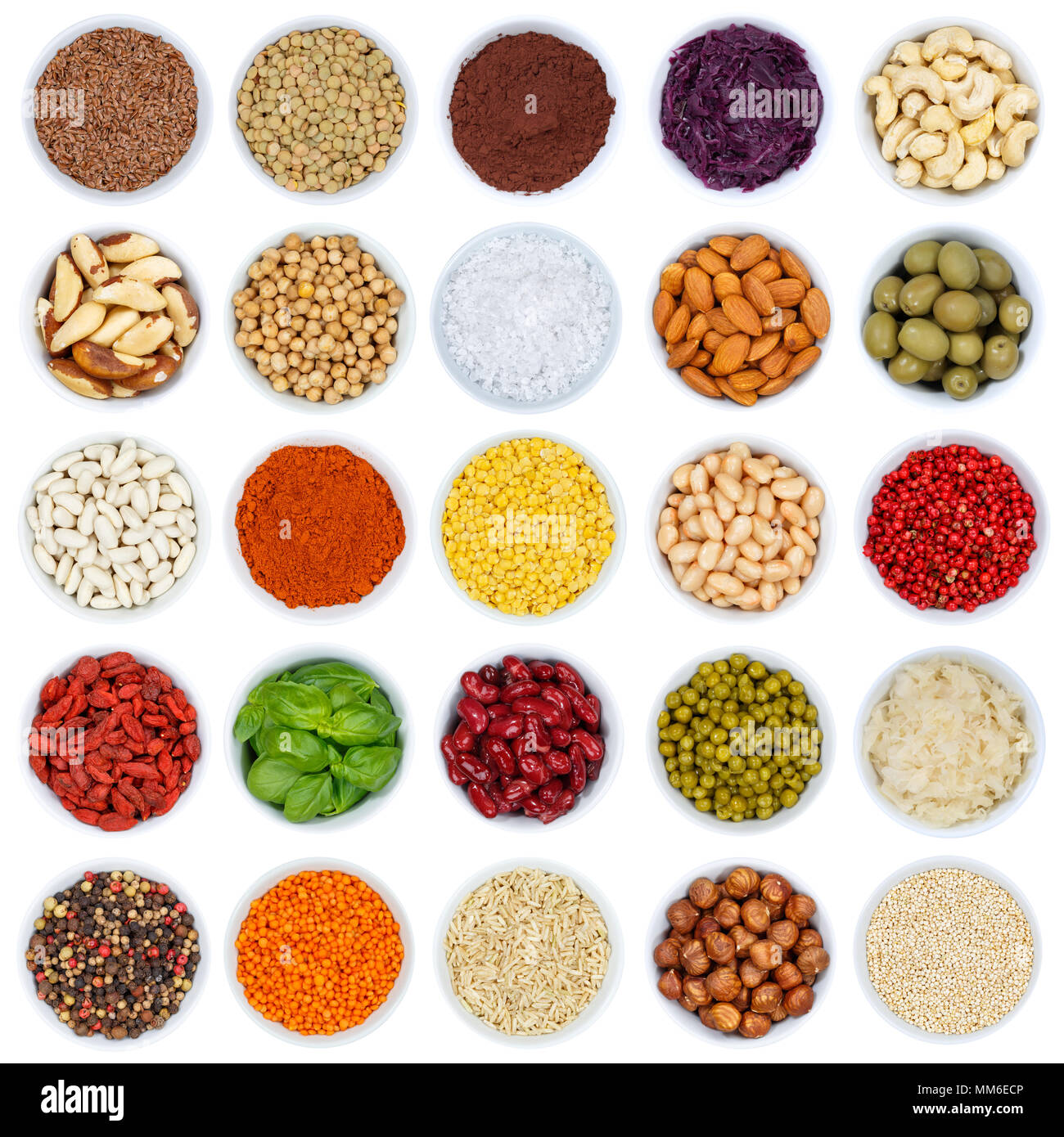 Collection of spices and herbs vegetables nuts square from above bowl isolated on a white background Stock Photo