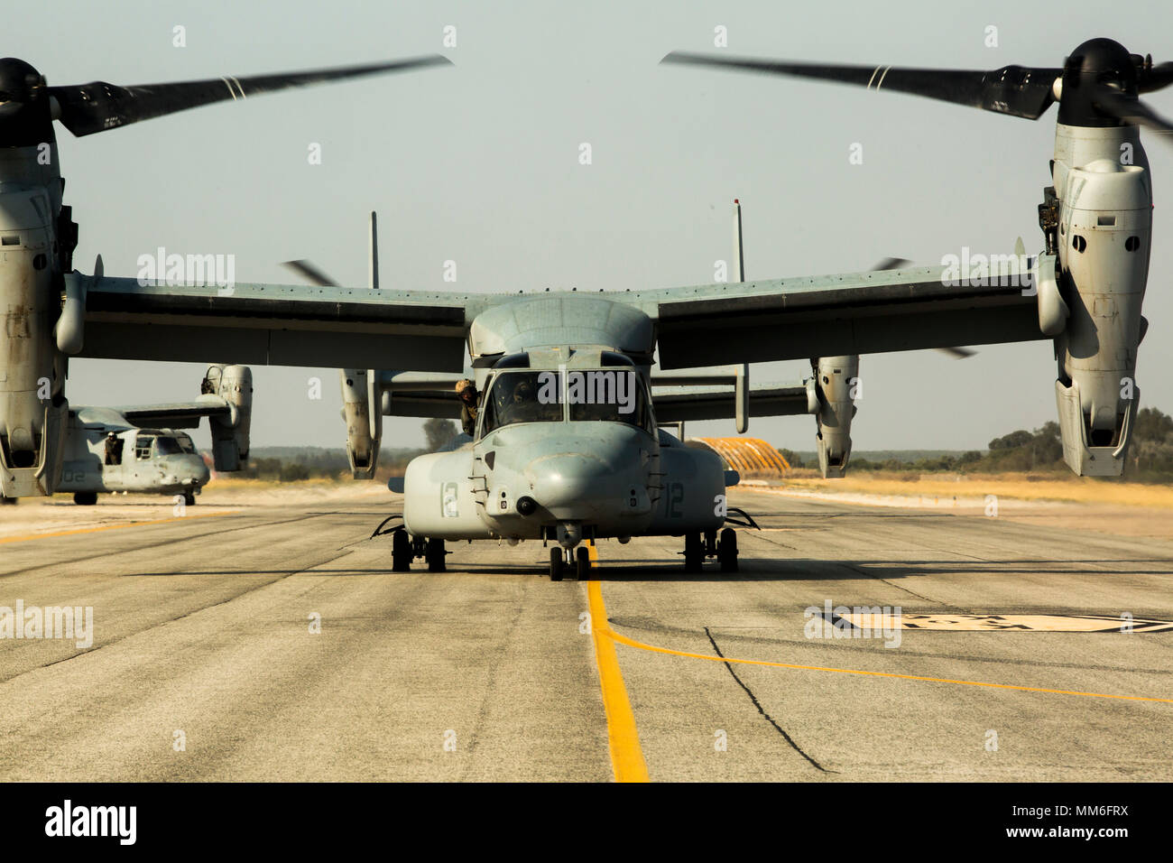 MV-22B Osprey aircraft assigned to the 24th Marine Expeditionary Unit taxi across the flightline at Morón Air Base Spain, Sept. 7, 2017. The 24th MEU sent aircraft and personnel to conduct maintenance while on station at Morón. (U.S. Marine Corps Photo by Cpl. Jodson B. Graves) Stock Photo
