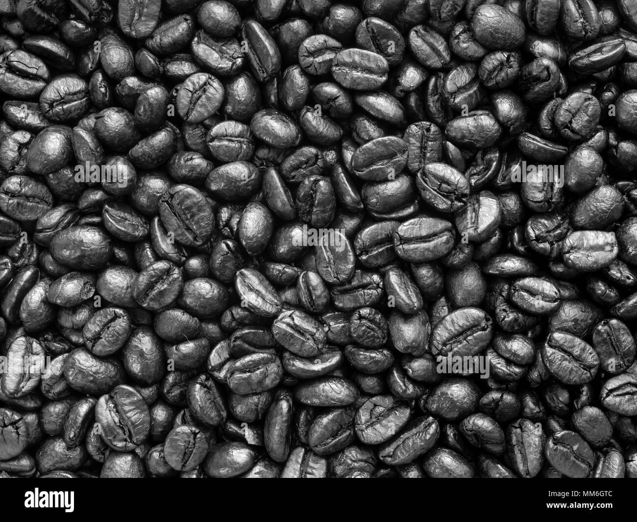 Roasted black coffee beans, can be used as a background and texture