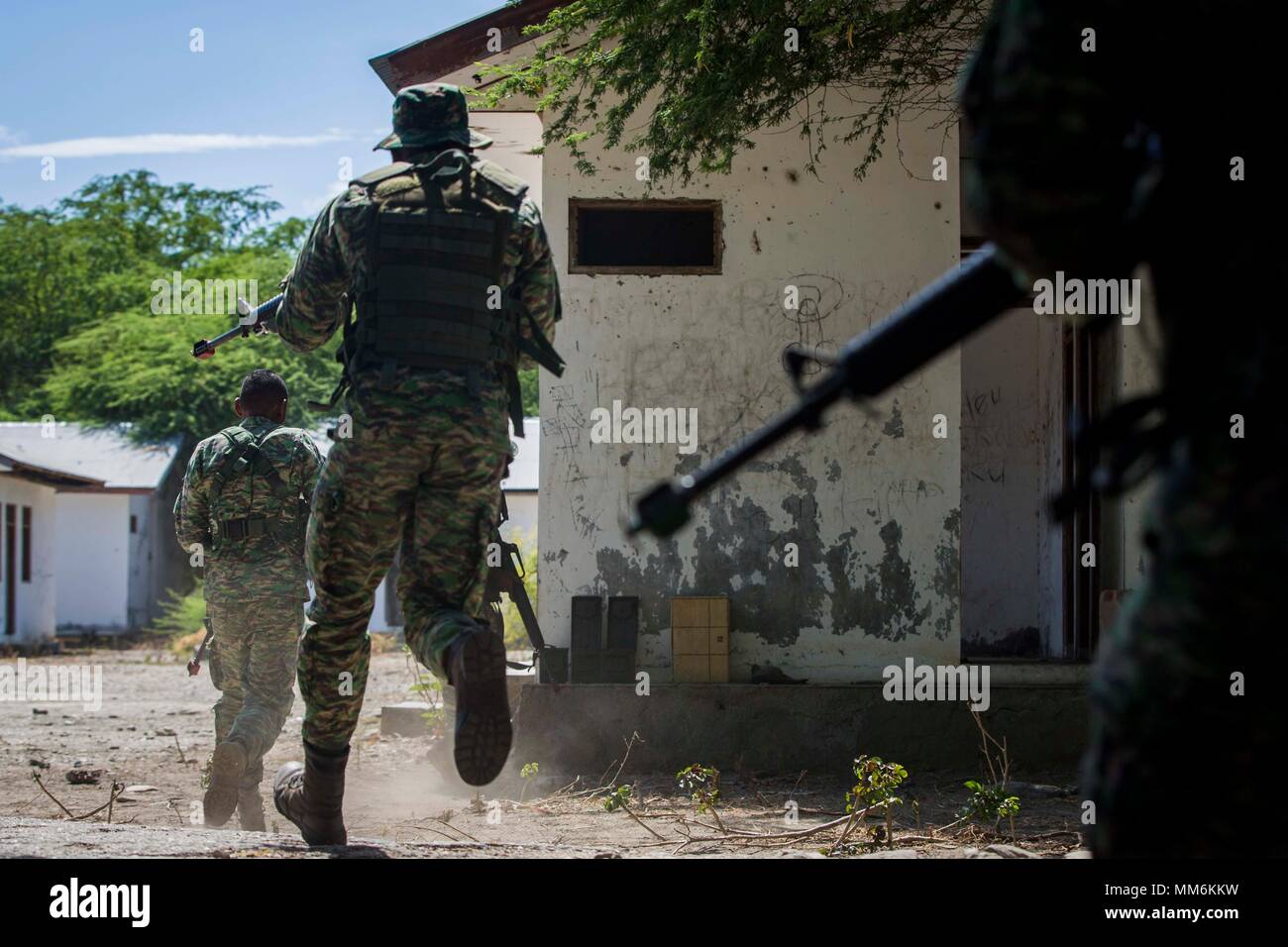 Members of the Falantil Forca de Defensa Timor Leste participate in Military Operation Urban Terrain training during Exercise Crocodilo as a part of Exercise Koa Moana 17 in Metinaro, Timor Leste, Sept. 7, 2017. Koa Moana 17 is designed to improve interoperability with our partners, enhance military-to-military relations, and expose the Marine Corps forces to different types of terrain for familiarity in the event of a natural disaster in the region.   (U.S. Marine Corps photo by MCIPAC Combat Camera Lance Cpl. Juan C. Bustos) Stock Photo