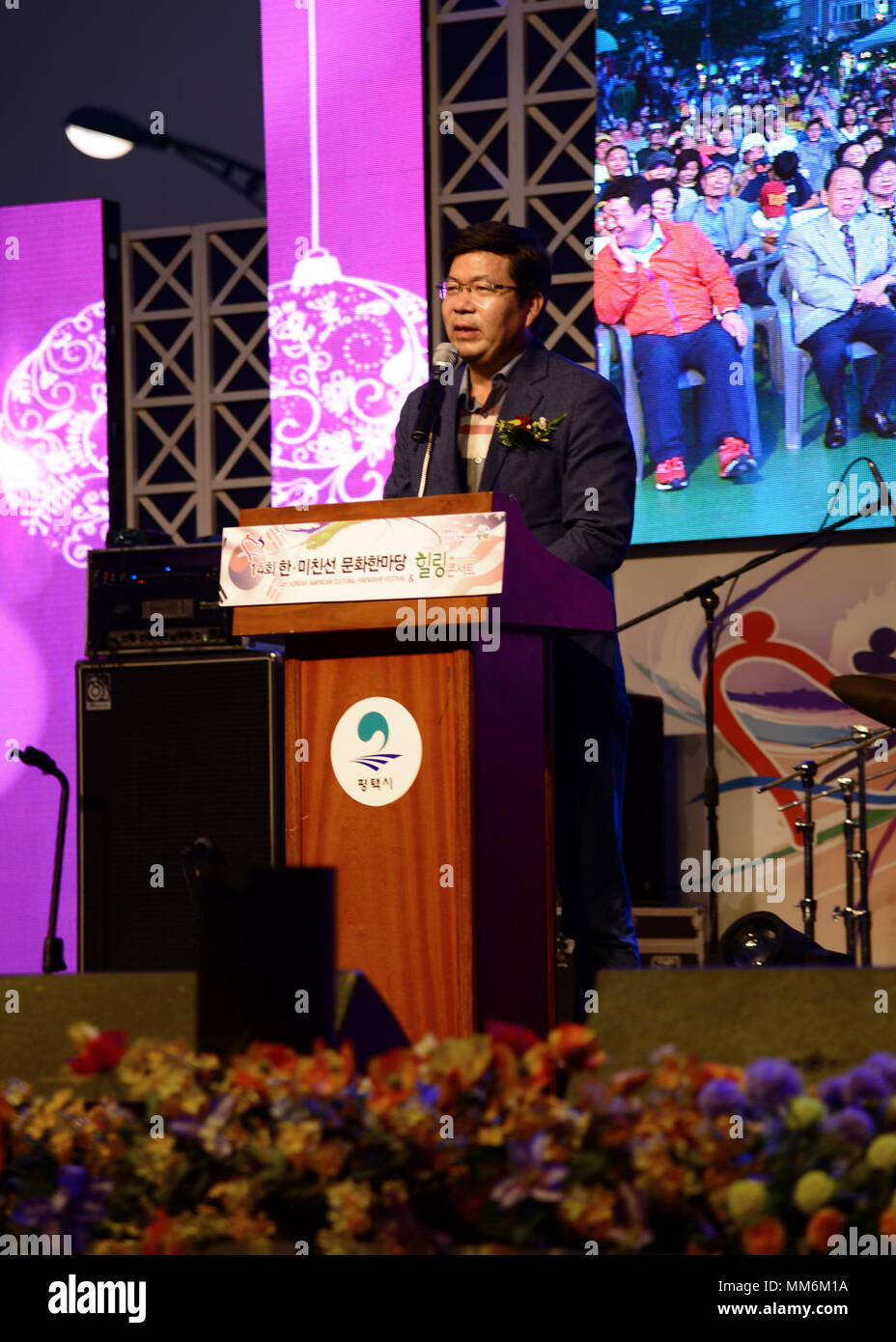 Mr. Kong Jae Kwang, Pyeongtaek City Mayor, speaks during the opening ceremonies of the 14th Annual Korean American Cultural Friendship Festival near Osan Air Base, September 9, 2017. The festival is a two day celebration of the united community between the Korean and American people near Osan Air Base. (U.S. Air Force photo by Staff Sgt. Tinese Jackson) Stock Photo