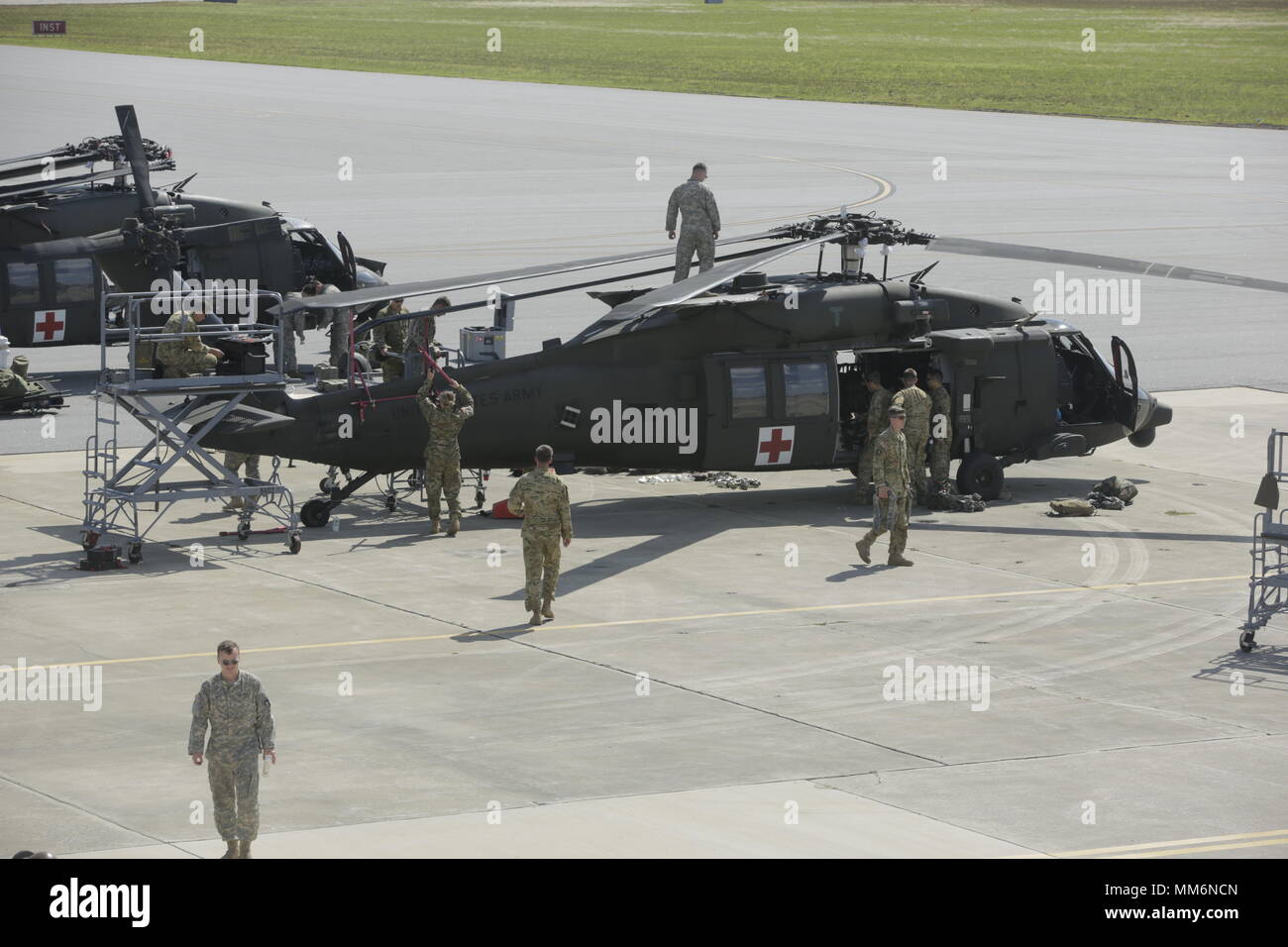 U.S. Soldiers, Charlie Company, 6th Battalion, 101st Aviation Regiment, stage thier HH-60M, Patrick Airforce Base, Fl., Sept. 12, 2017. Soldiers stage helicopters in preparation for medical operations in the Hurricane Irma relief process.  (U.S. Army photo by Pfc. Joseph Cannon) Stock Photo