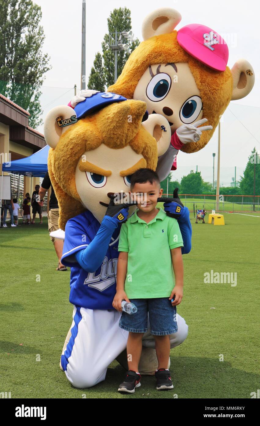 Oscar Abril 4 Poses With The Mascots Of The Samsung Lions A South Korean Professional Baseball Team Located In The City Of Daegu During The Boys And Girls Clubs Of America Annual