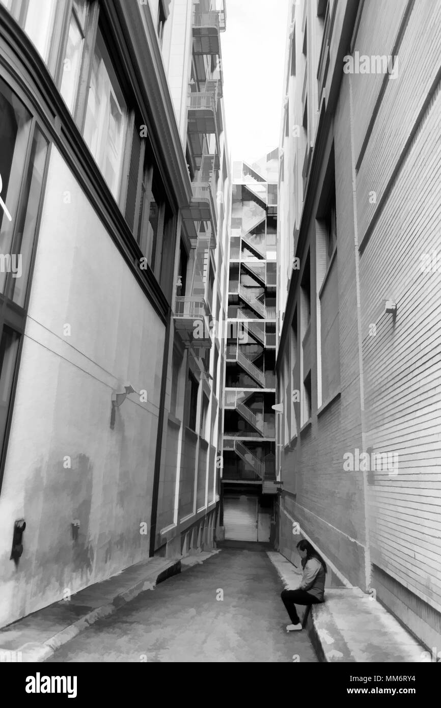 Asian woman smoking while on phone in narrow alley with tall buildings. Black and white. Stock Photo