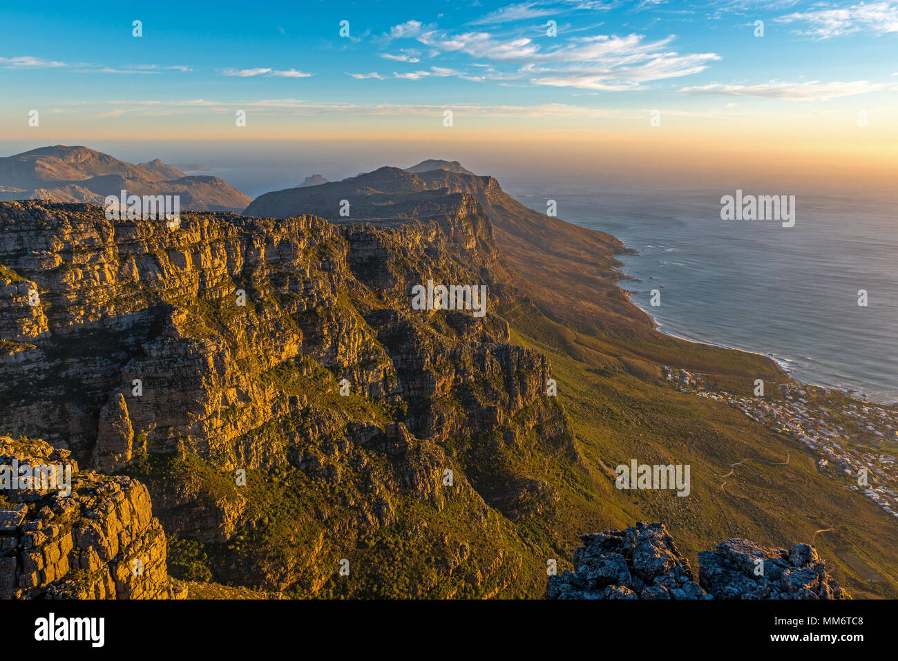 Sunset landscape of the Table Mountain national park with the city of Cape Town seen from above and the Atlantic Ocean in South Africa. Stock Photo