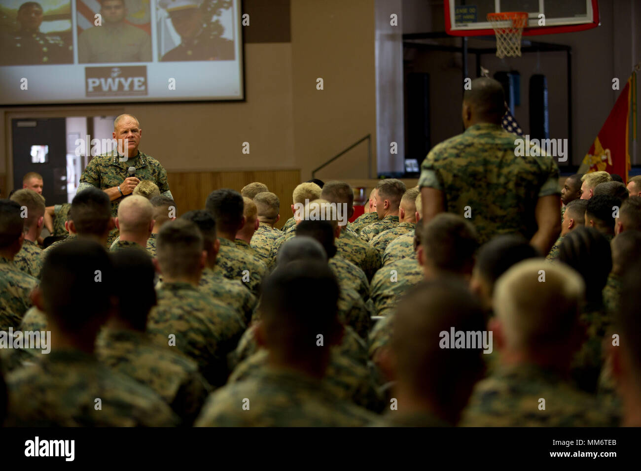 Commandant of the Marine Corps, Robert B. Neller answers questions from Marines and Sailors at Marine Corps Combat Service Support Schools and Field Medical Training Battalion-East on Camp Johnson, N.C., Sept. 7, 2017. General Neller and Sgt. Maj. Ronald L. Green visited Camp Johnson to inform Marines and Sailors on various subjects pertaining to the Marine Corps. (U.S. Marine Corps photo by Lance Cpl. Luis E. Zamot III) Stock Photo