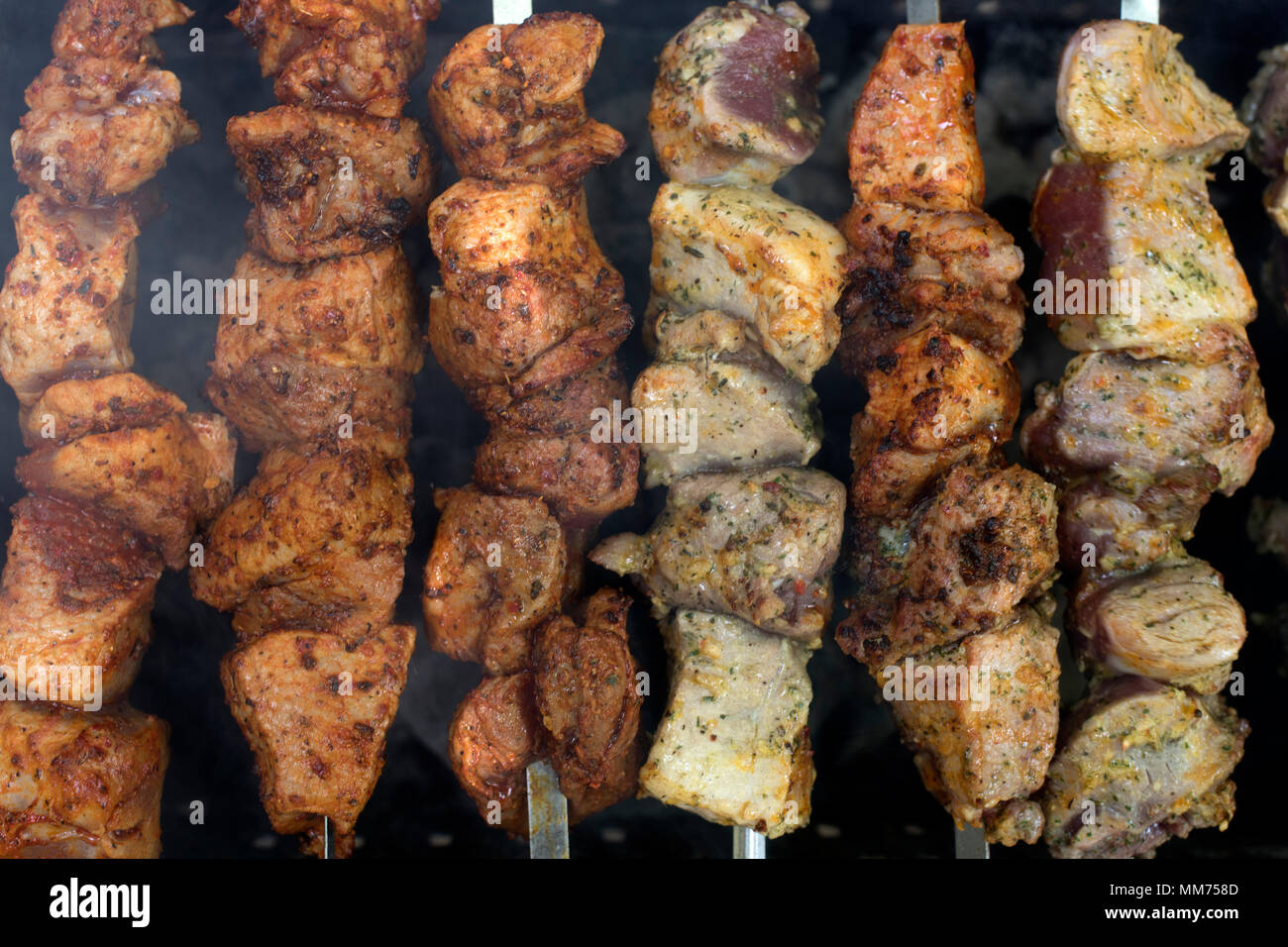 the big pieces of meat fried on a brazier by a shish kebab Stock Photo