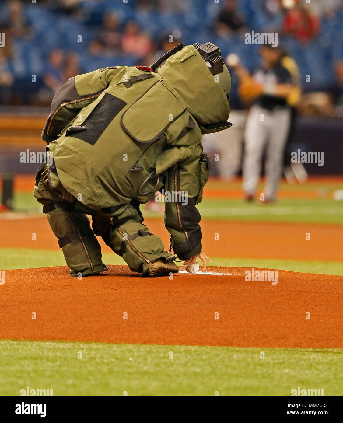 St. Petersburg, Florida, USA. 9th May, 2018. JIM DAMASKE | Times.A Navy EOD technician brings the ball out to the mound for the start of the Tampa Bay Rays home game against the Atlanta Braves at Tropicana Field in St. Petersburg, FL 5/9/2018. Credit: Jim Damaske/Tampa Bay Times/ZUMA Wire/Alamy Live News Stock Photo