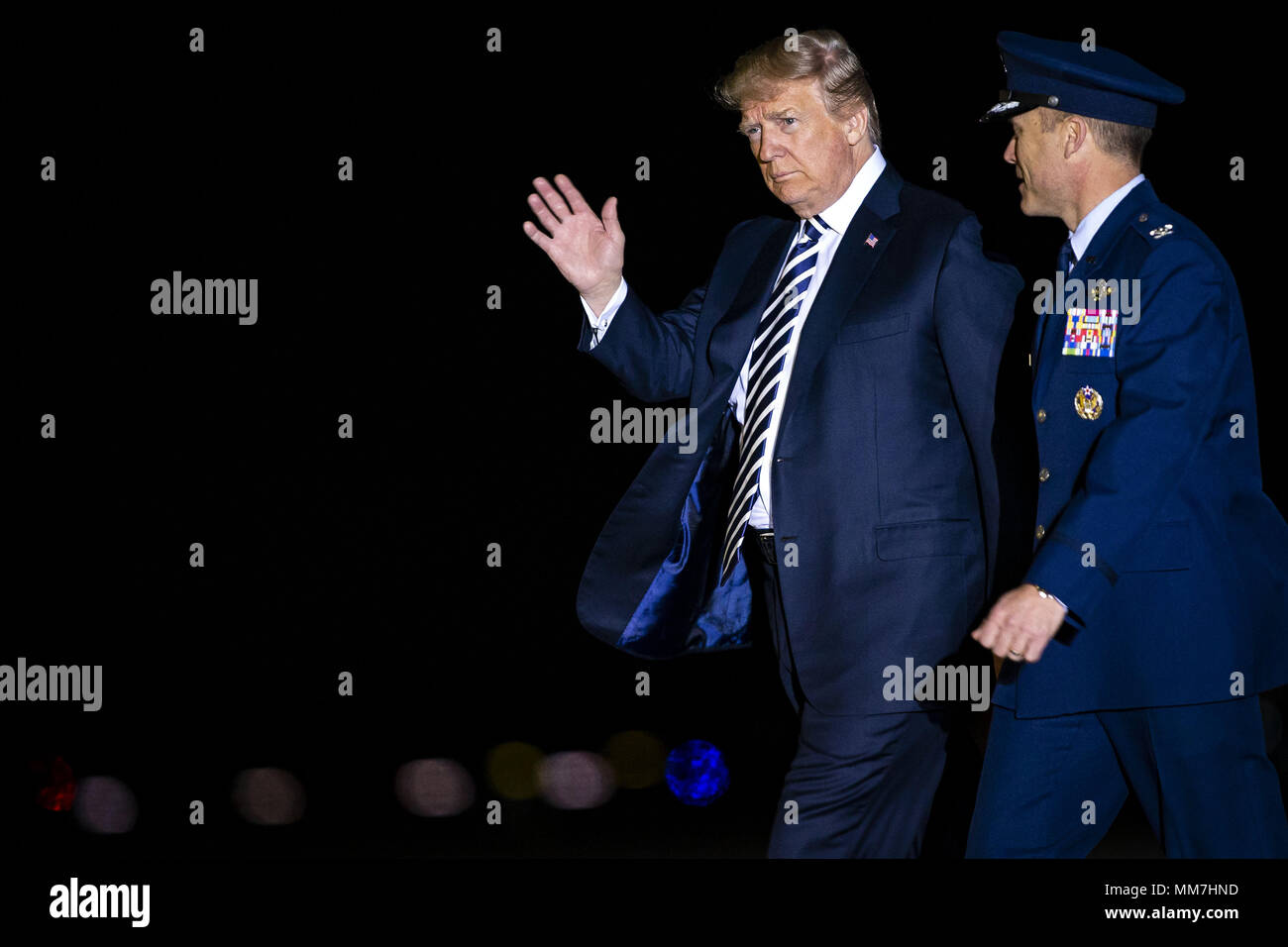 May 10, 2018 - Washington, District of Columbia, United States of America - U.S. President Donald Trump walks with Air Force Col. Casey Eaton, Commander, 89th Airlift Wing, before greeting American detainees before their arrival from North Korea at Joint Base Andrews, Maryland, U.S., on Thursday, May 10, 2018. North Korea released the three U.S. citizens who had been detained for as long as two years, a goodwill gesture ahead of a planned summit between President Donald Trump and Kim Jong Un that's expected in the coming weeks. Credit: Al Drago/Pool via CNP (Credit Image: © Al Drago/CNP via Stock Photo