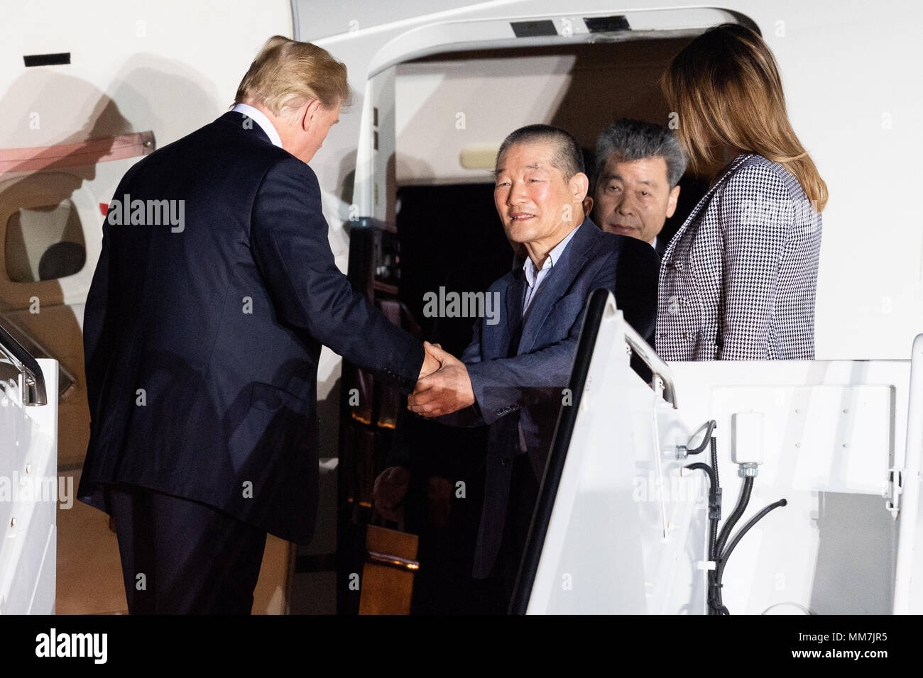 President Donald Trump and his wife Melania welcoming the three American detainees (Kim Dong-chul, Kim Hak-song, and Tony Kim) held in captivity in North Korea at Joint Base Andrews in Suitland. Stock Photo