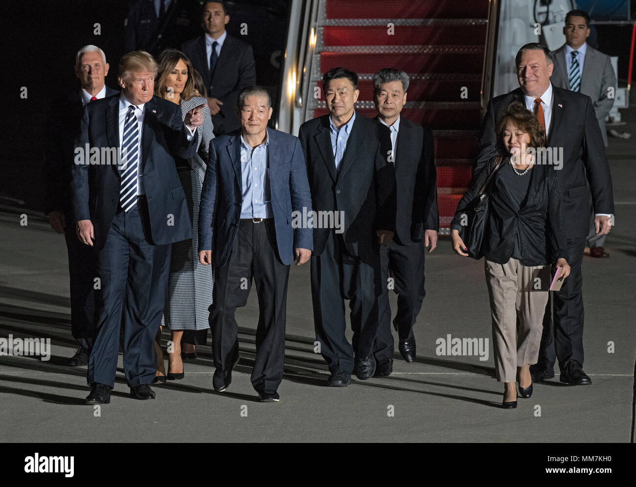 United States President Donald J. Trump welcomes Kim Dong Chul, Kim Hak Song and Tony Kim back to the US at Joint Base Andrews in Maryland on Thursday, May 10, 2018. The three men were imprisoned in North Korea for periods ranging from one and two years. They were released to US Secretary of State Mike Pompeo as a good-will gesture in the lead-up to the talks between President Trump and North Korean leader Kim Jong Un. Pictured with the President are US Vice President Mike Pence, first lady Melania Trump, and US Secretary of State Mike Pompeo. Credit: Ron Sachs/CNP /MediaPunch Stock Photo