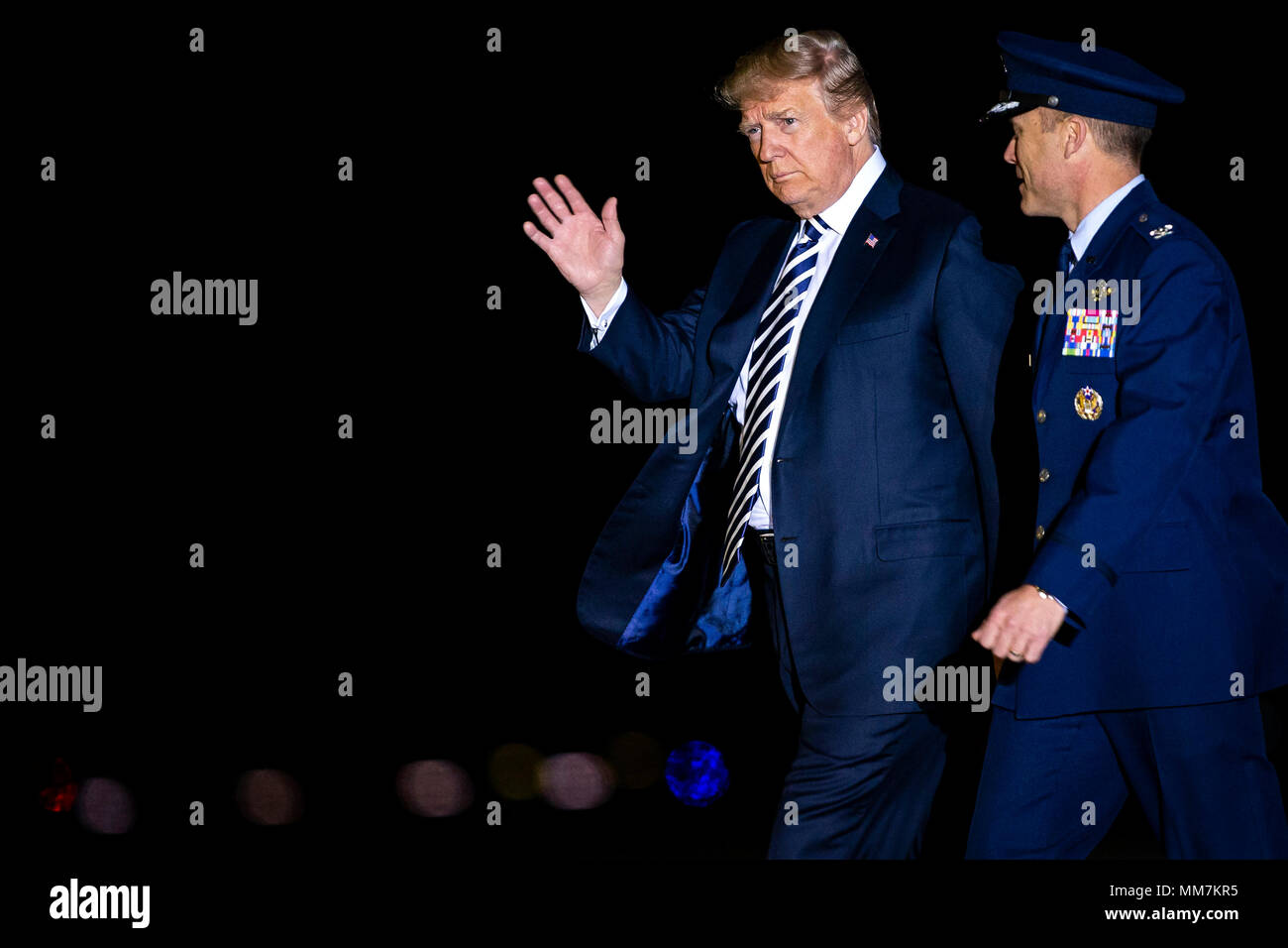 U.S. President Donald Trump walks with Air Force Col. Casey Eaton, Commander, 89th Airlift Wing, before greeting American detainees before their arrival from North Korea at Joint Base Andrews, Maryland, U.S., on Thursday, May 10, 2018. North Korea released the three U.S. citizens who had been detained for as long as two years, a goodwill gesture ahead of a planned summit between President Donald Trump and Kim Jong Un that's expected in the coming weeks. Credit: Al Drago/Pool via CNP /MediaPunch Stock Photo