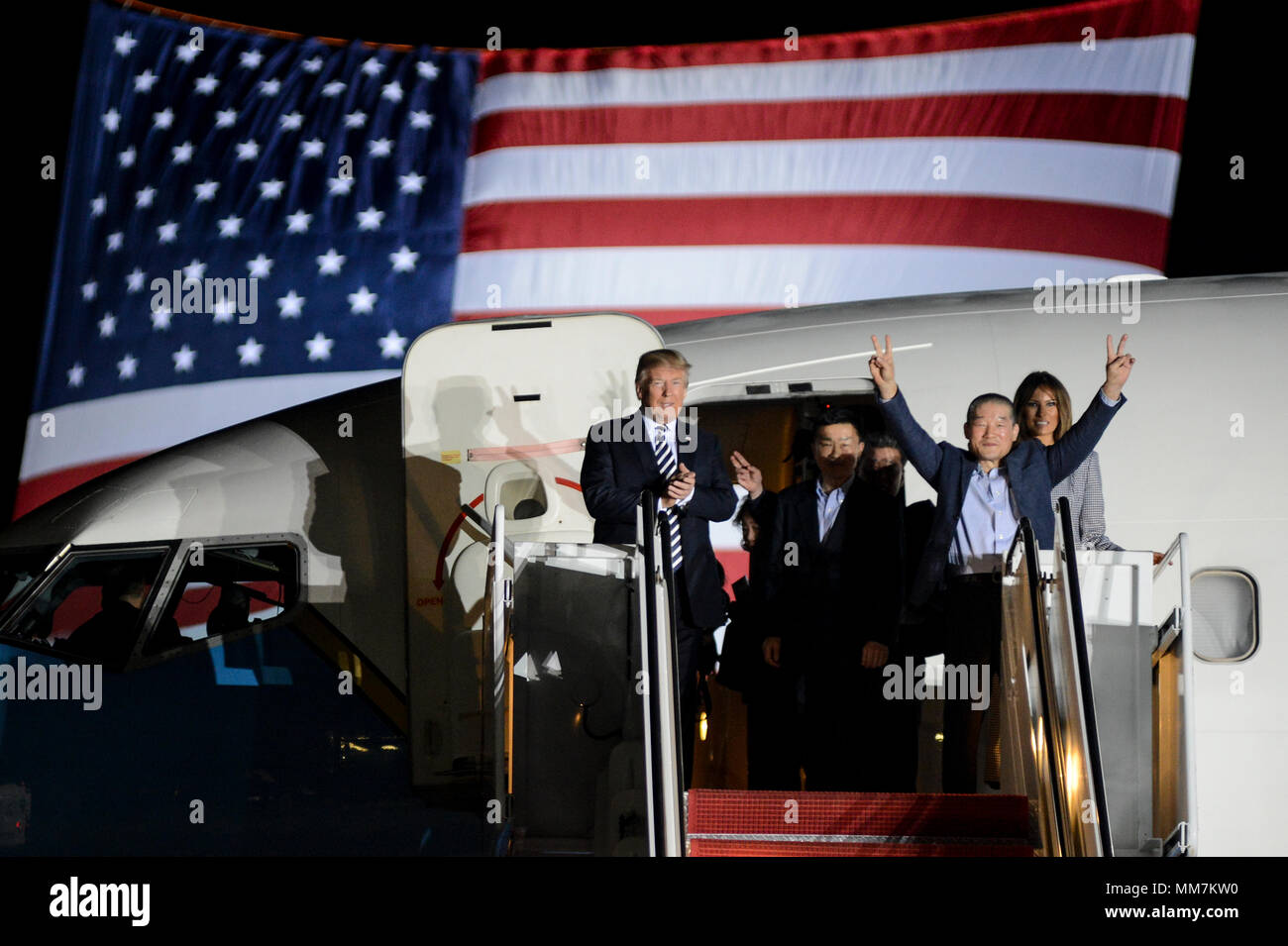 U.S. President Donald Trump and First Lady Melania Trump welcome home three American detainees freed by North Korea on arrival at Joint Base Andrews May 10, 2018 in Clinton, Maryland. The three include Kim Dong-chul, Tony Kim and Kim Hak-song released as a gesture of goodwill ahead of the planned meeting between Trump and North Korean leader Kim Jong-un. Stock Photo