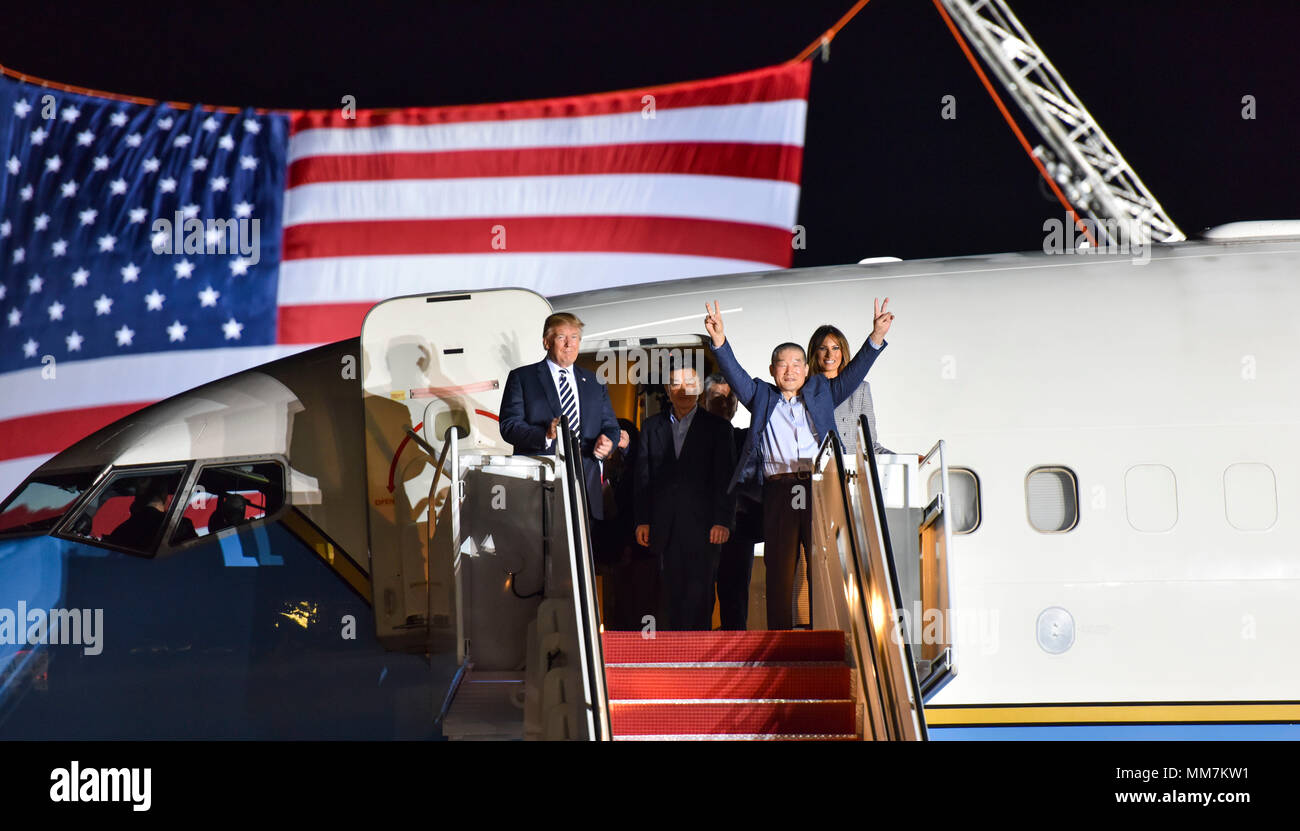 U.S. President Donald Trump and First Lady Melania Trump welcome home three American detainees freed by North Korea on arrival at Joint Base Andrews May 10, 2018 in Clinton, Maryland. The three include Kim Dong-chul, Tony Kim and Kim Hak-song released as a gesture of goodwill ahead of the planned meeting between Trump and North Korean leader Kim Jong-un. Stock Photo