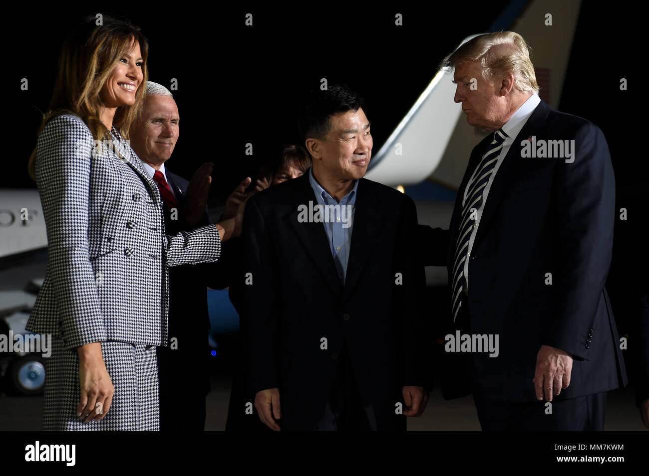U.S. President Donald Trump, Vice President Mike Pence and First Lady Melania Trump welcome home three American detainees freed by North Korea on arrival at Joint Base Andrews May 10, 2018 in Clinton, Maryland. The three include Kim Dong-chul, Tony Kim and Kim Hak-song released as a gesture of goodwill ahead of the planned meeting between Trump and North Korean leader Kim Jong-un. Stock Photo