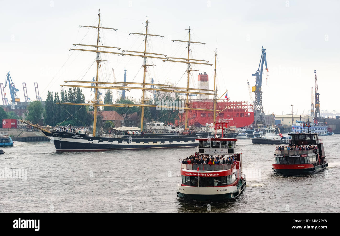 10 May 2018, Germany, Hamburg: Together with more than 100 ships of all sizes, the Russian tall ship parades on the River Elbe for the inauguration of the anniversary of Hamburg's Harbour. Approximately one million visitors are expected to attend the largest Harbour festivity in the world. The festivities will end on 13 May 2018 with a large outlet parade. Photo: Markus Scholz/dpa Stock Photo