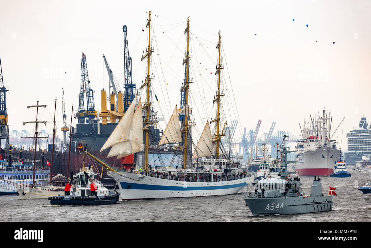 10 May 2018, Germany, Hamburg: Together with more than 100 ships of all sizes, the Russian tall ship parades on the River Elbe for the inauguration of the anniversary of Hamburg's Harbour. Approximately one million visitors are expected to attend the largest Harbour festivity in the world. The festivities will end on 13 May 2018 with a large outlet parade. Photo: Markus Scholz/dpa Stock Photo