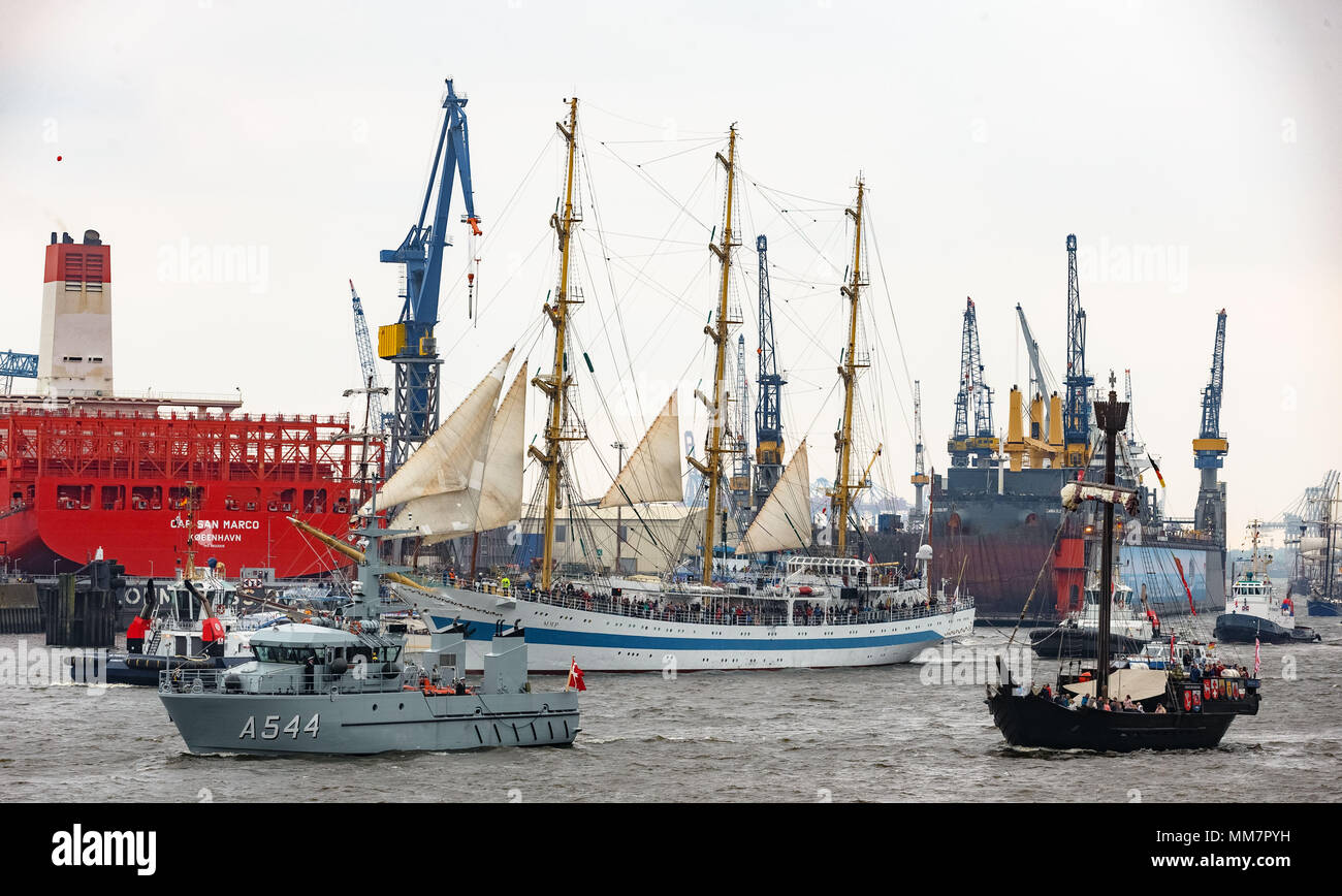 10 May 2018, Germany, Hamburg: Together with more than 100 ships of all sizes, the Russian tall ship parades on the River Elbe for the inauguration of the anniversary of Hamburg's Harbour. Approximately one million visitors are expected to attend the largest Harbour festivity in the world. The festivities will end on 13 May 2018 with a large outlet parade. Photo: Markus Scholz/dpa Stock Photo