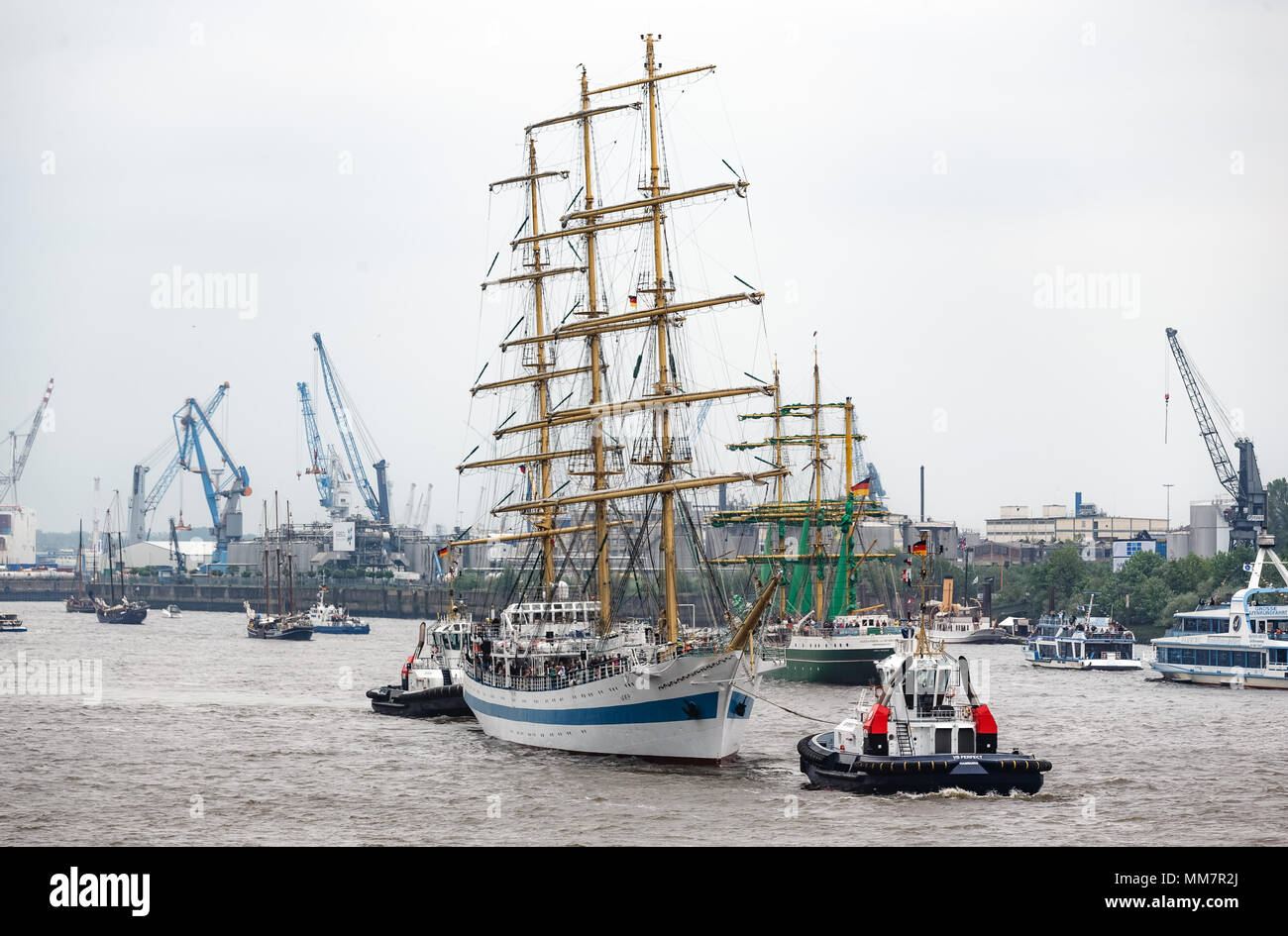 10 May 2018, Germany, Hamburg: Together with more than 100 ships of all sizes, the Russian tall ship parades on the River Elbe for the inauguration of the anniversary of Hamburg's Harbour. Approximately one million visitors are expected to attend the largest Harbour festivity in the world. The festivities will end on 13 May 2018 with a large outlet parade. Photo: Markus Scholz/dpa Stock Photo