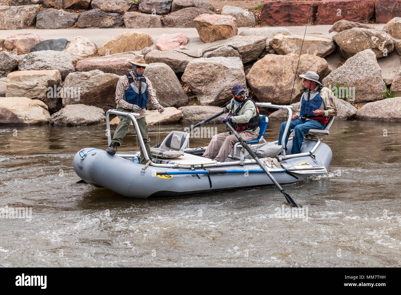 Professional guide & clients fly fishing from a boat on the Arkansas River, Salida, Colorado, USA Stock Photo