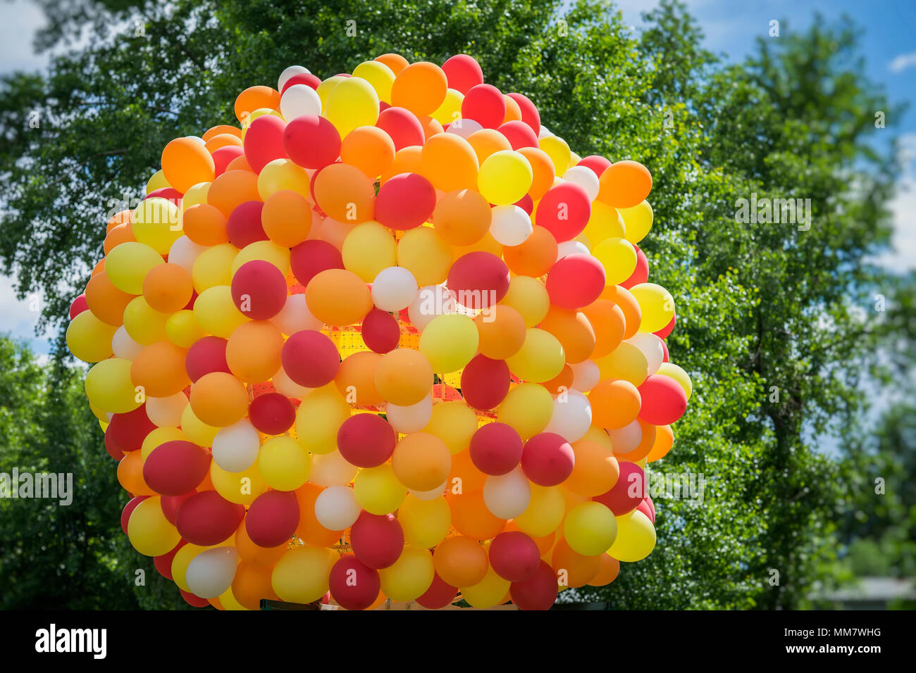 Huge bundle of balloons balloons in golden orange-red colors, party,  birthday, celebration,. Festive concept Stock Photo - Alamy