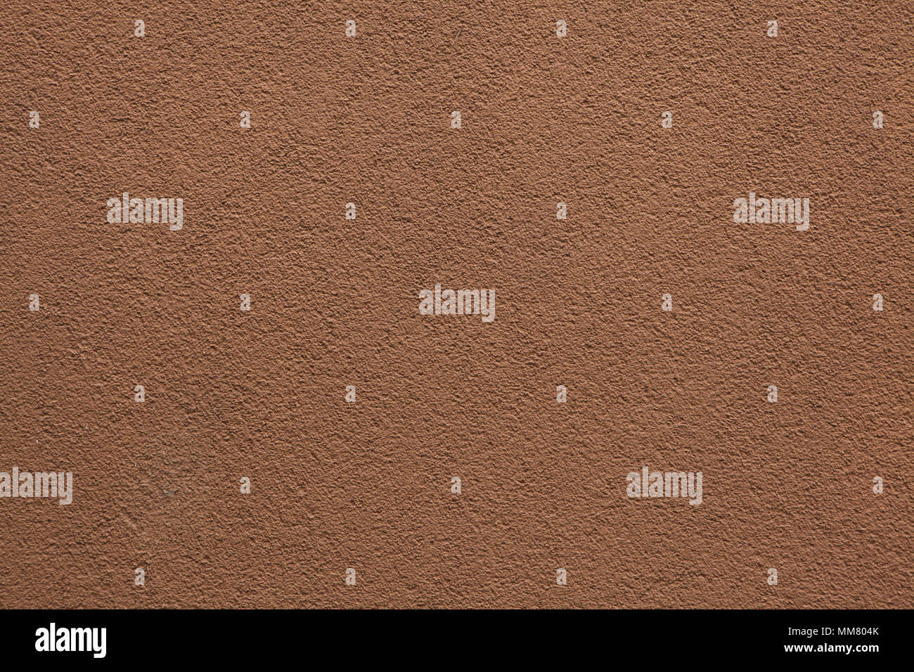 Brown painted stucco wall. Background texture. Stock Photo