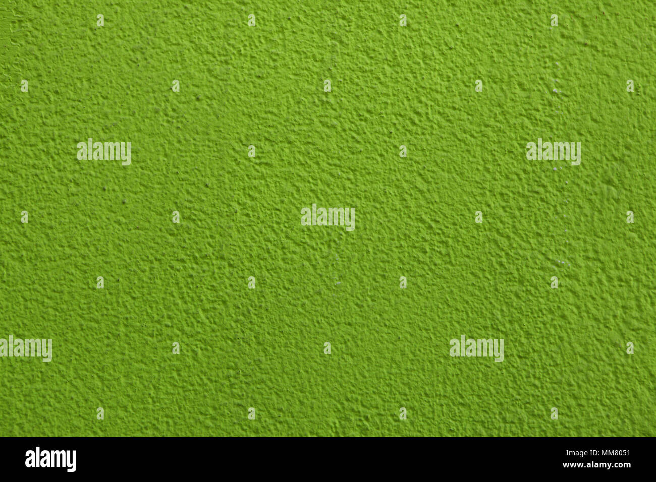 Green painted stucco wall. Background texture. Stock Photo