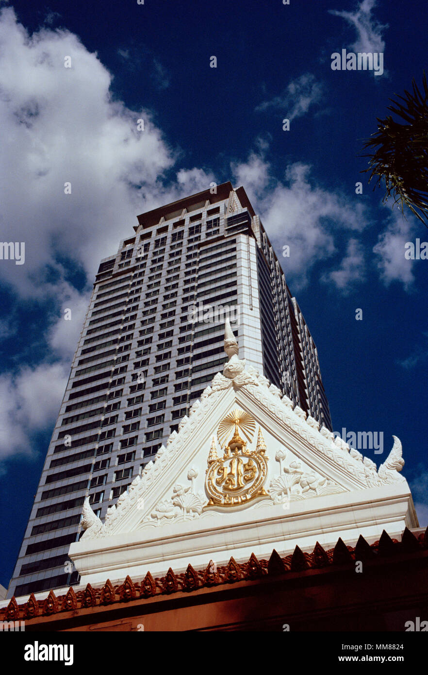Buddhist temple Wat Pathum Wanaram amongst modern buildings in Bangkok in Thailand in Southeast Asia Far East. Architecture Building City Travel Stock Photo