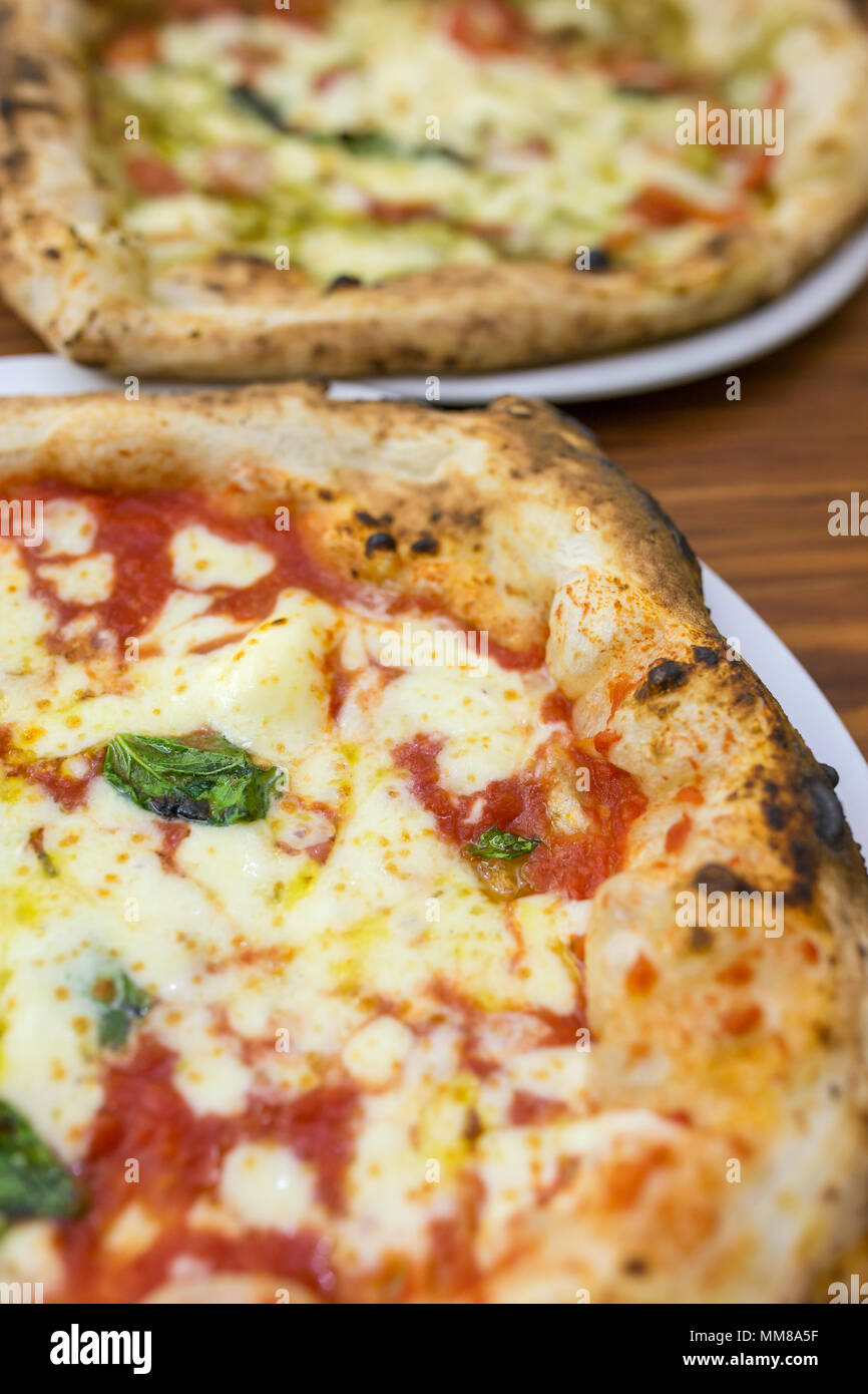 Original neapolitan pizza margherita , served in Naples restaurant