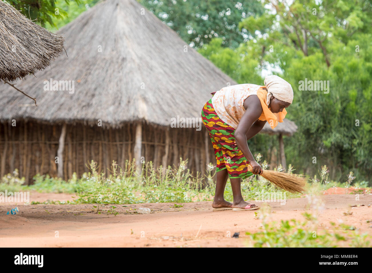 African Woman Sweeping Stock Photos & African Woman Sweeping Stock ...