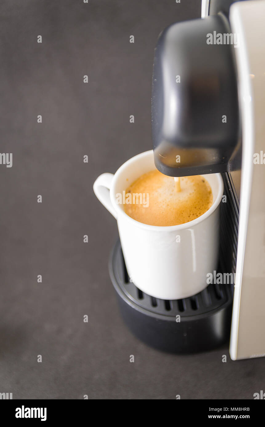 Coffee maker serving coffee, espresso, coffee pod Stock Photo Alamy